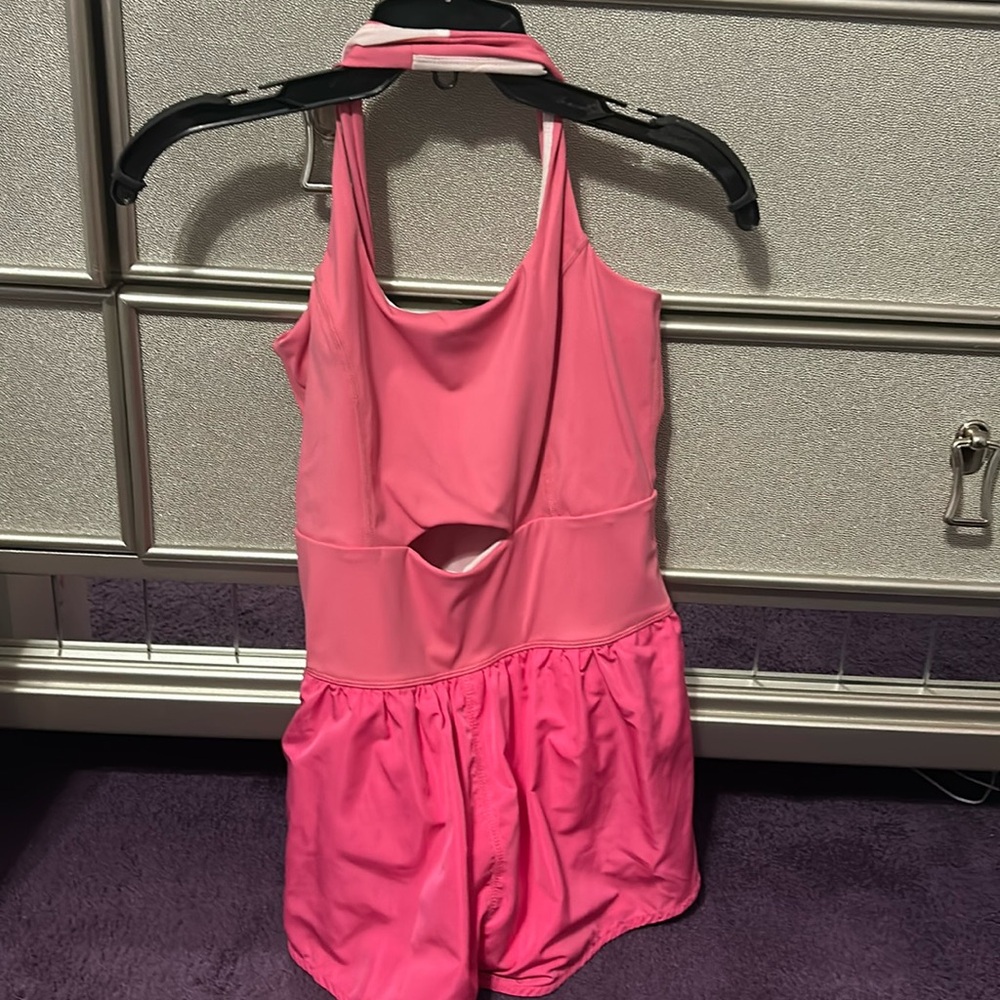Dry fit material light pink crosses in the back never worn !
